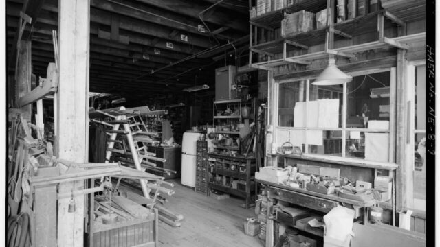 Northeast from south entrance across receiving area of factory past the glass